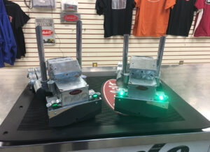 Two handmade metal Peterbilt-style model trucks built from hardware-store parts